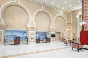 a large lobby with chairs and tables in a store at Marriott Hotel Jabal Omar Makkah in Mecca +159 photos
