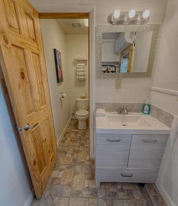 a bathroom with a sink and a toilet at Pinion 6 Mokee in Bluff Kitchen, Sleeps 4 in Bluff +32 photos