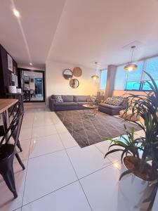 a living room with a couch and a table at Finagaello 3 bedrooms-Self catering at 77 on Independence in Windhoek