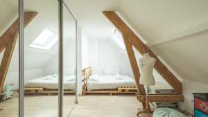 a bedroom with a bed and a glass room at Villa Coubertin in La Rivière-de-Corps