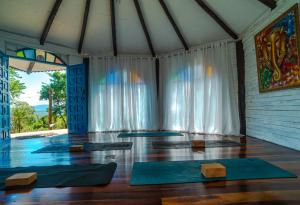 a meditation room with yoga mats in front of a window at OctoCabana com banheira e mirante privativo in Urubici