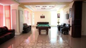 a living room with couches and a table in it at Naparis Boutique in Eforie Sud