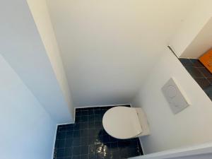 a bathroom with a white toilet in a room at Triplex de charme avec vue in Brussels +19 photos