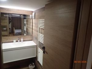 a bathroom with a sink and a mirror at Chambre Privée avec Sauna in Villeneuve-Loubet +8 photos