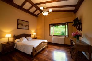 Llit o llits en una habitació de Agroturismo Ibarre