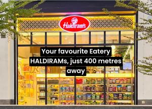 a store with a sign in front of a refrigerator at The Velvet Nest - Gurgaon - Luxurious Single Bedroom Private Villa with Garden in Gurgaon +14 photos