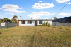 a house with a large yard in front of it at Sea Gem in Lancelin