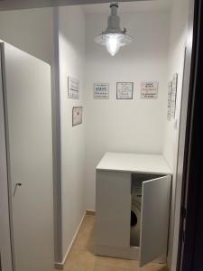 a laundry room with a washer and dryer at Seewohnung Zentral in Millstatt
