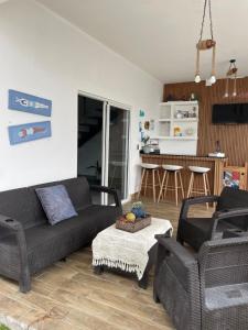 a living room with a couch and two chairs at Simon Vip Complete Villa in Punta Cana