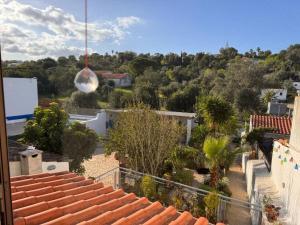 a view of the garden from the roof of a house at Lovely Room Silves in Silves