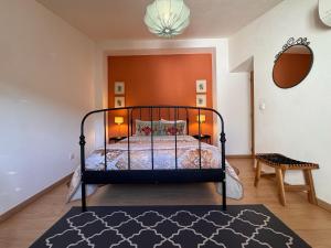 a bedroom with a bed with a black frame at Lovely Room Silves in Silves +33 photos