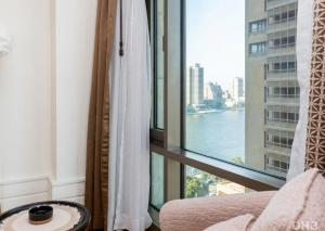 a room with a window with a view of the water at The St Regis Luxury in Cairo