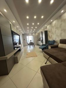 a large living room with a tv and a couch at Martone house in Castellammare di Stabia