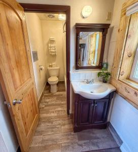 a bathroom with a sink and a toilet at Hózhó King Mokee Shared Kitchen, Pets Ok #2 in Bluff +30 photos