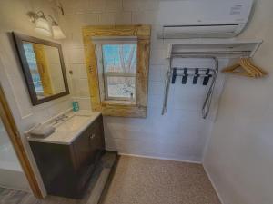 a small bathroom with a sink and a window at King Bear Mokee Pets OK, Shared Kitchen! #4 in Bluff +28 photos