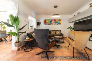 a living room with two chairs and a couch at The Denia Hideaway in Denia