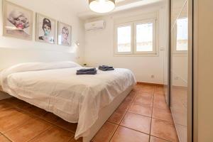 a bedroom with a large bed and a mirror at The Denia Hideaway in Denia +42 photos