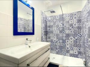 a bathroom with a sink and a shower at Anzio lighthouse terrace family-group friendly in Anzio +27 photos