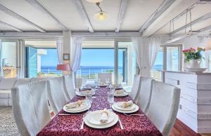 a dining room with a table and chairs at Villa Tempera in Vis +29 photos