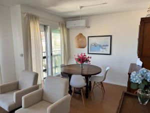 a living room with a table and chairs at Celestia in Punta del Este