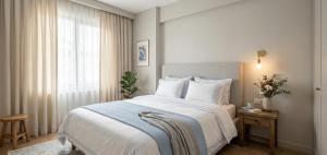 a bedroom with a large bed and a window at Levent Hotel in Lara