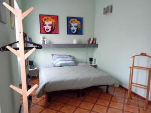 a bedroom with a bed and a shelf on the wall at Ca' melindetta in Recetto