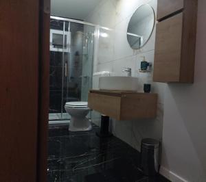 a bathroom with a toilet and a sink and a shower at Room Depikolo 2 in Krk +9 photos
