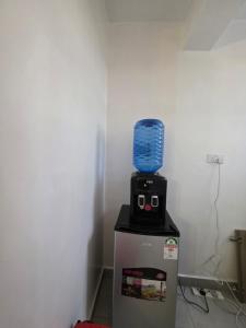 a blender sitting on top of a refrigerator at Bibo cabins in Ruringʼu +4 photos