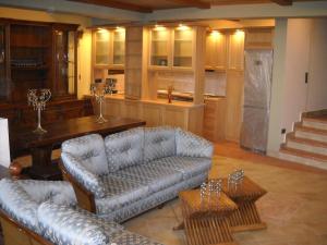 a living room with a couch and a table at Evelin Apartment in Portaria