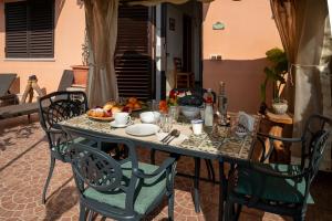 a table with a plate of fruit on it at B&B Tirreno- Finestra sul Mare in Contrada Mastrissa