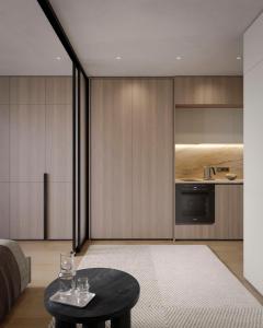 a living room with a table and a kitchen at Apart-hotel Centr in Sumy