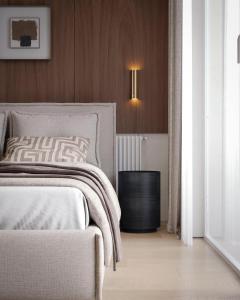 a bedroom with a bed and a night stand next to it at Apart-hotel Centr in Sumy