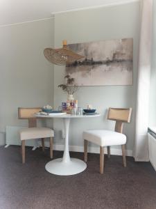 a table and two chairs and a table and chairs at Villa Kakelbont in Leeuwarden