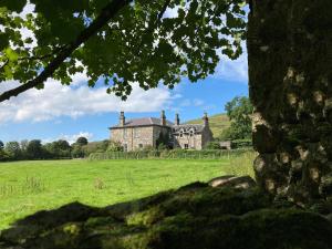 an old house in a field with a green field at Blarcreen in Oban +28 photos