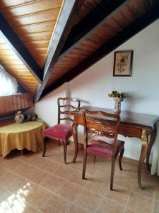 a dining room with a table and two chairs at Anastasia in Áno Lekhónia +47 photos