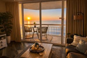 a living room with a view of the ocean at Waters Edge in Myrtle Beach