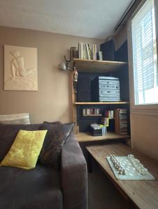 a living room with a couch and a table at Le Domaine de Cécile by Alto Service in Perpignan
