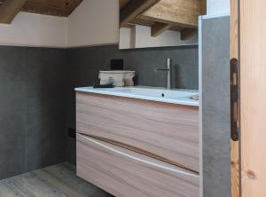 a bathroom with a tub and a sink at Silva: The Alpine Chalet in Livigno +73 photos