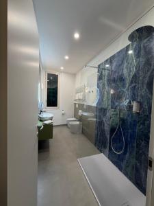 a bathroom with a shower and a sink and a toilet at Sette Note Guest House in Arezzo +89 photos