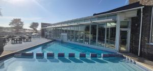 a swimming pool in front of a building at Caravan J&L Weymouth Bay in Weymouth