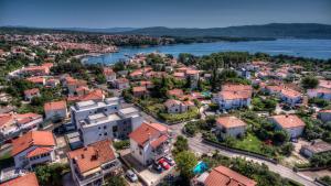 an aerial view of a town next to a river at LuxArt City Spa Gallery Residence Krk in Krk