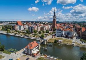 an aerial view of a city with a river at Apartament na Starówce in Elblag +9 photos