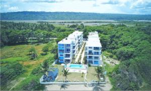 an aerial view of a large building in the jungle at Luxury Cabarete East Condominiums in Cabarete