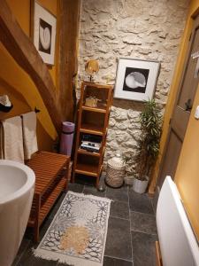 a bathroom with a sink and a bath tub at La Maison d'ART in Lacour