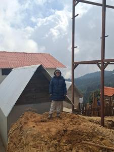 a person standing on top of a pile of dirt at Sunya Homestay in Kirāntīchhāp
