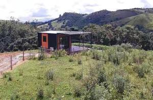 a small house sitting on top of a hill at Villa D Castro in Gonçalves