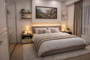 a bedroom with a large bed and two night stands at Extra Apartman in Banja Luka