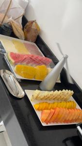 a table with different types of cheese and crackers at Pousada Na Serra in Ubajara