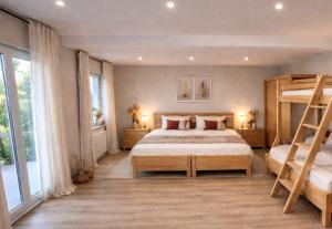 a bedroom with a bunk bed and a ladder at Haus der alten Bäume - Retreathaus Hillesheim in Hillesheim +13 photos