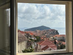 a view of a city from a window at guesthouse Libertas 3 in Dubrovnik